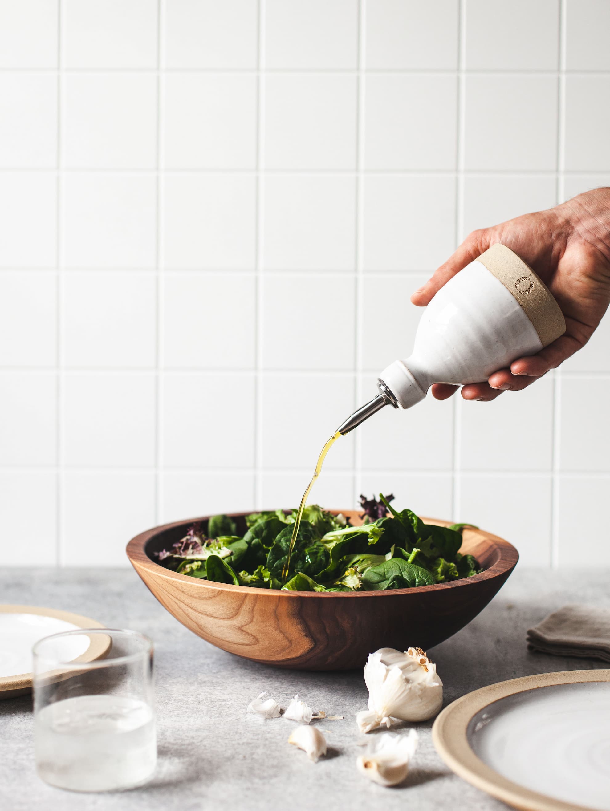 A cook reaching into the salt cellar mid-recipe
