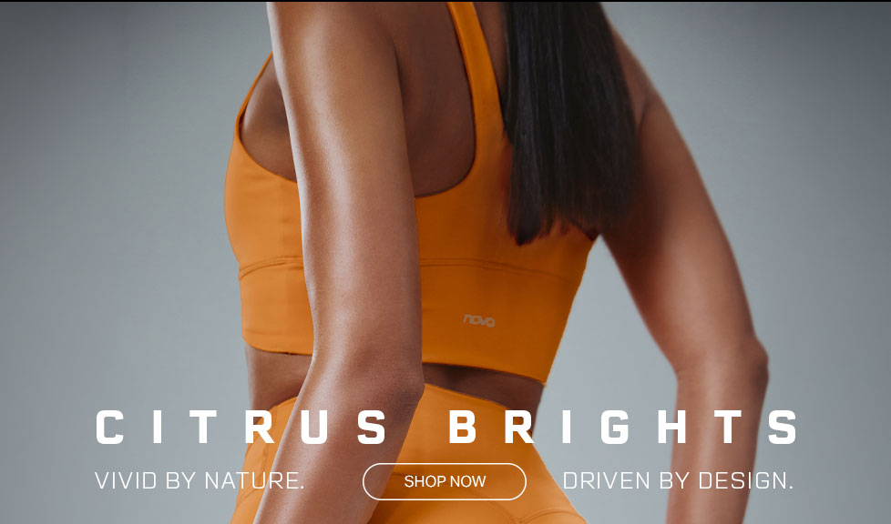 Novo Citrus Brights activewear: woman wearing orange sports bra and leggings. Shop vivid fitness apparel.