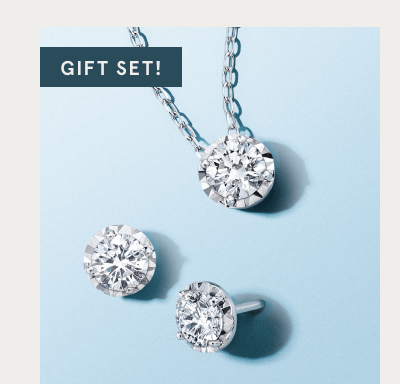 Gift set of white gold diamond pendant necklace and matching stud earrings. 