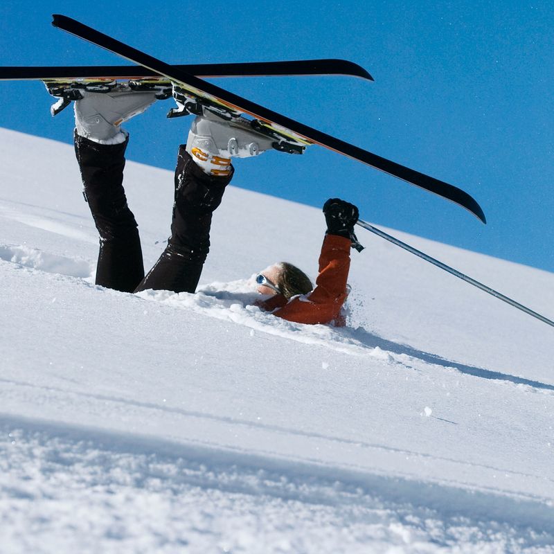 Person with skis in snow. 