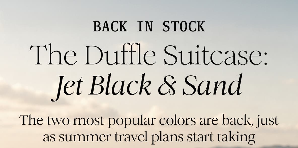 BACK IN STOCK - The Duffle Suitcase: Jet Black & Sand  - The two most popular colors are back, just as summer travel plans start taking shape.