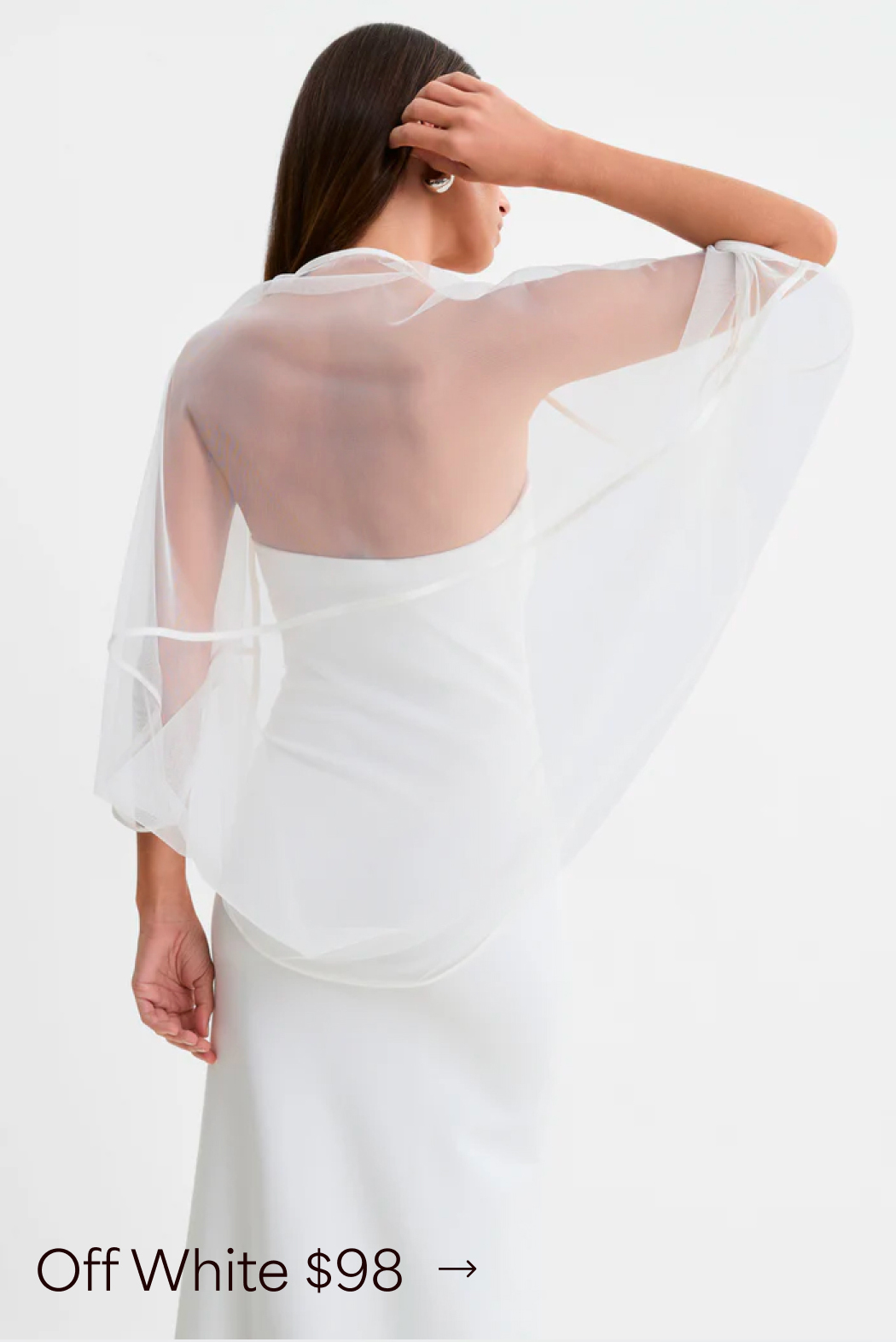 A back view of Rocio in an off-white The Stella Bolero, labeled “Off White $98.”