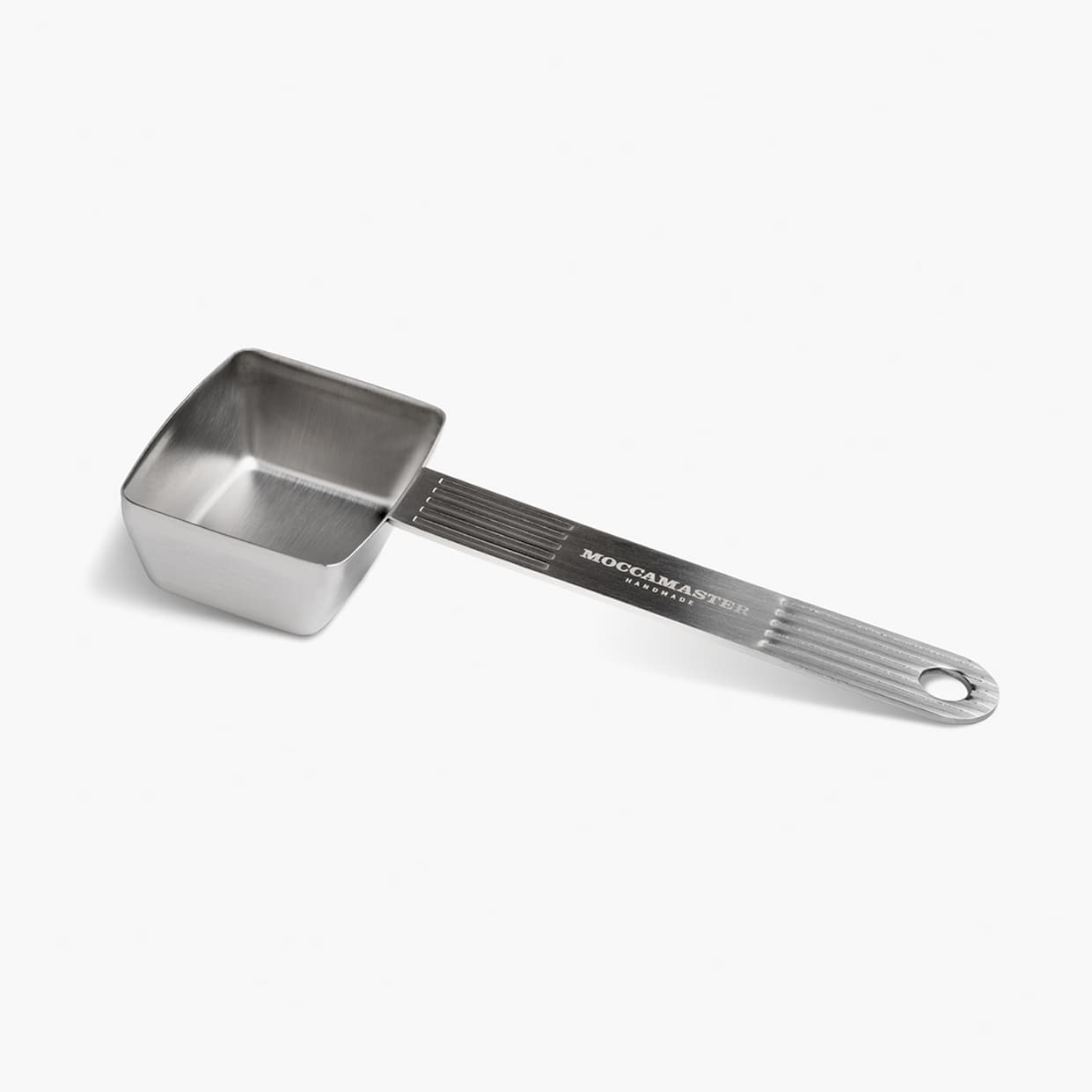 Stainless steel coffee scoop on a white background