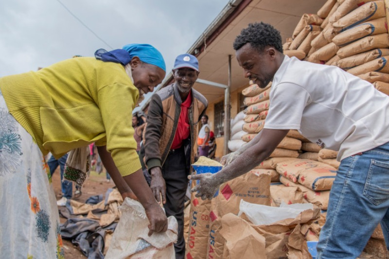 Aid workers distribute food supplies in Tigray’s camp for internally displaced people.