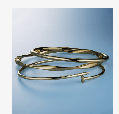 Three layered gold bracelets.