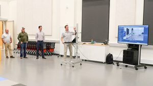 researchers present at front of classroom