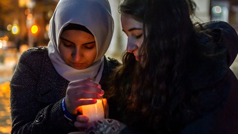 People attend an interfaith ceremony remembering victims of the Holocaust in New York.