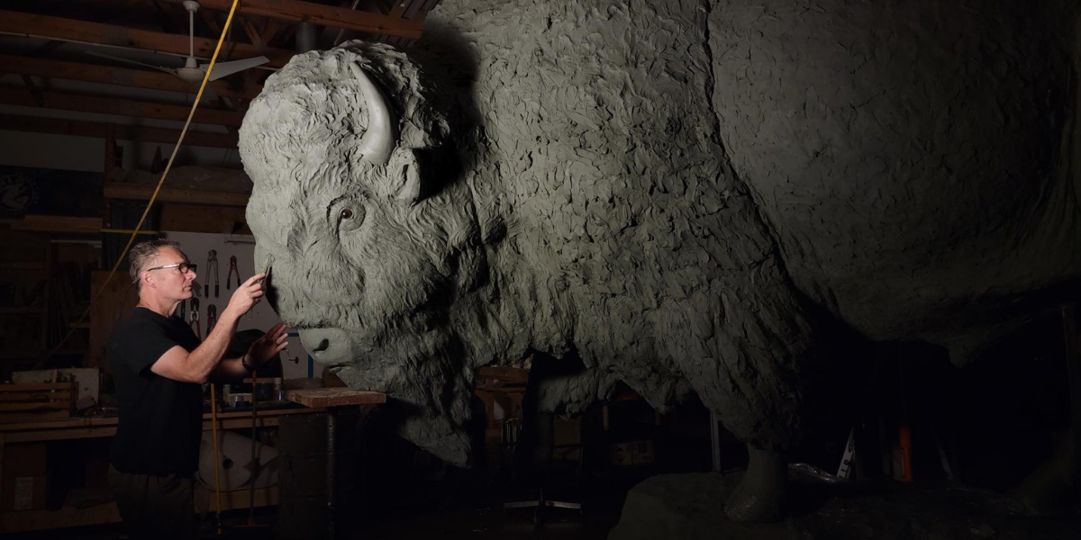 Wildlife artist Gary Staab prepares the bull bison sculpture in his studio