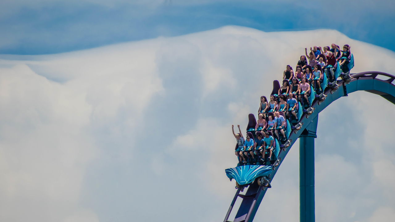 People enjoying  a rollercoaster ride 