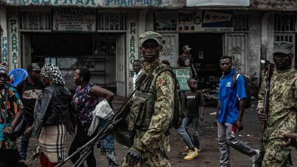 An M23 soldier walks down the street in Goma