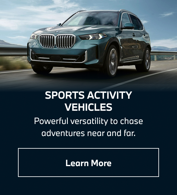 BMW Sports Activity Vehicle driving down the road. Learn more.
