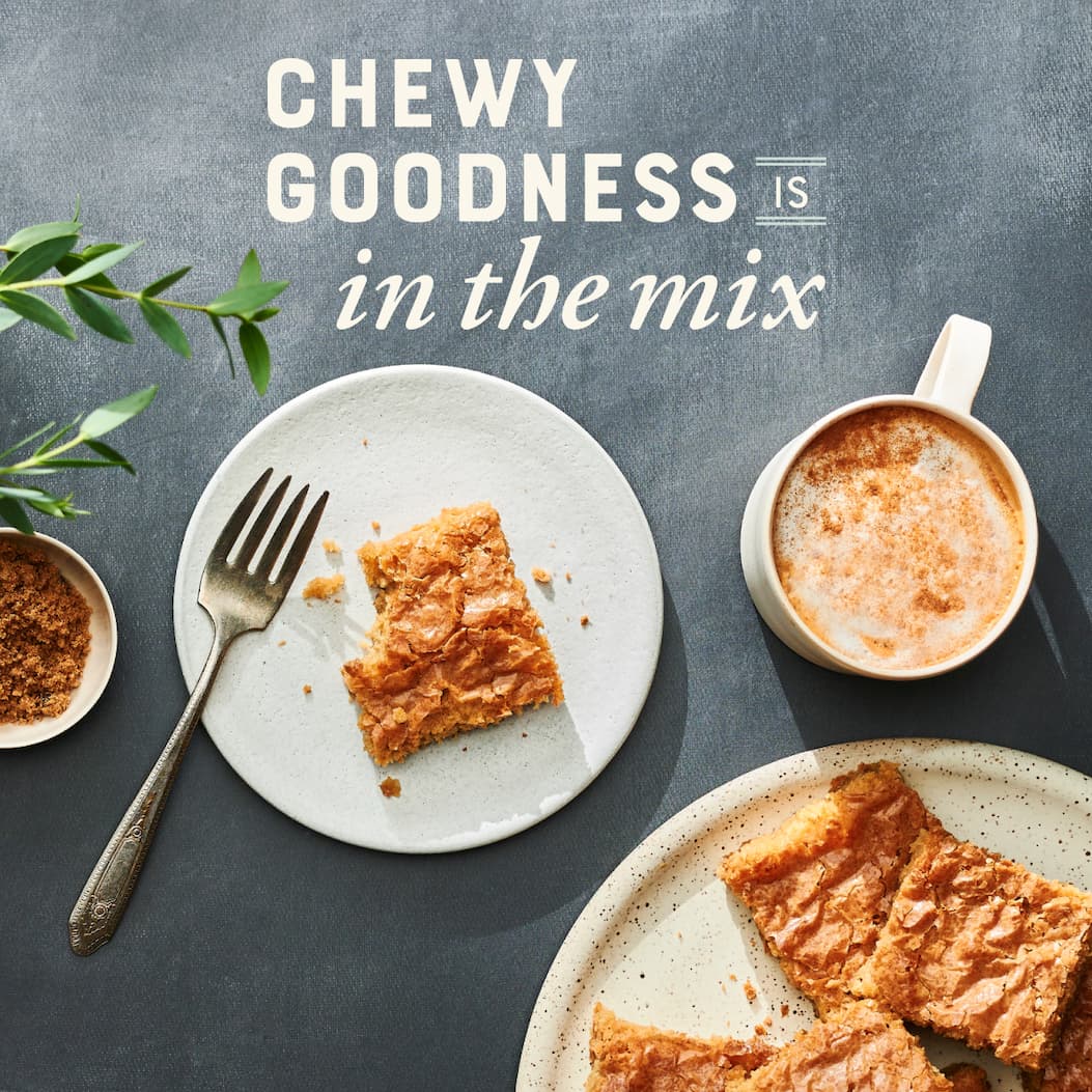 Chewy goodness is in the mix. Image of Brown Sugar Blondie on a plate with a bite taken.