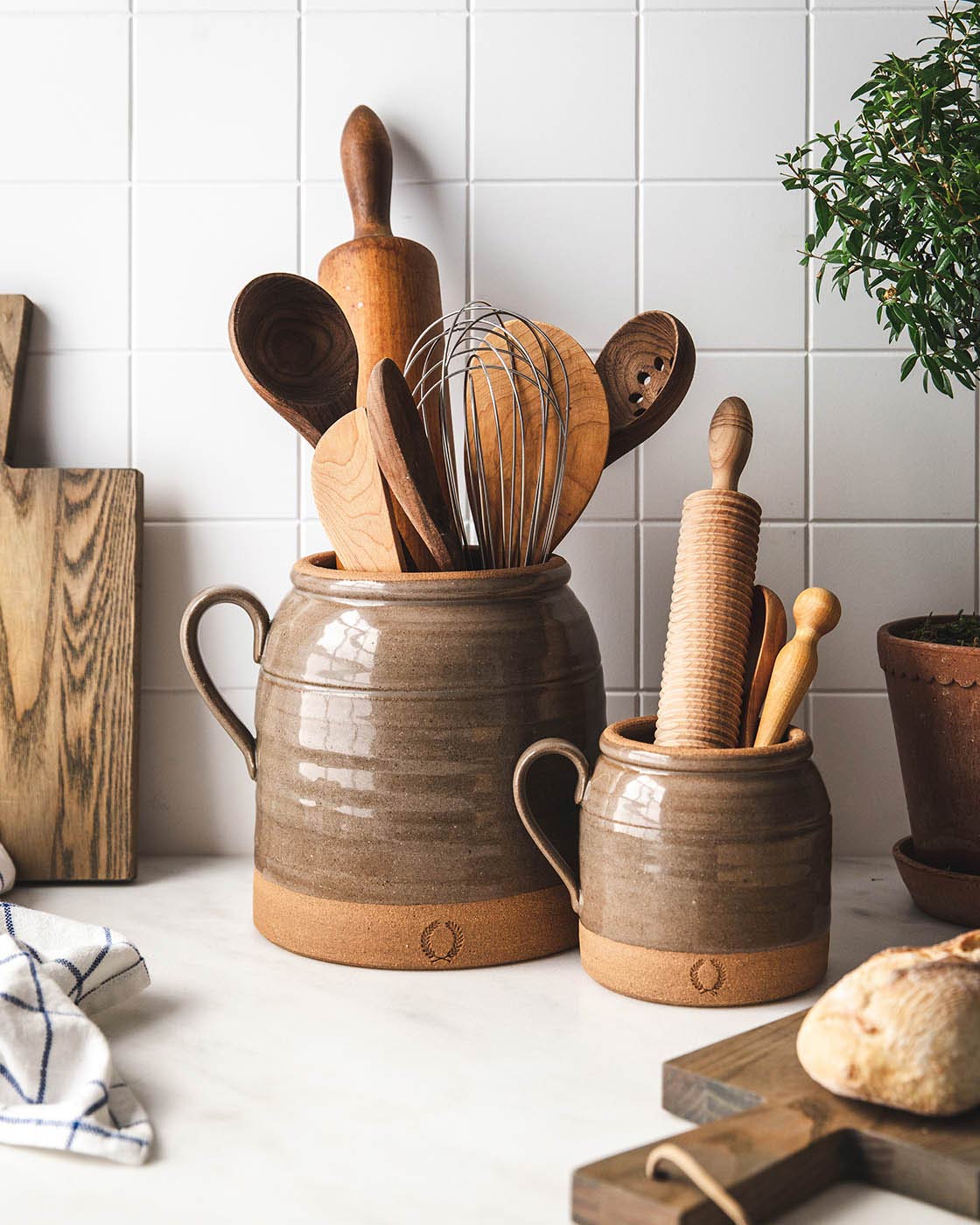 Crock holding kitchen utensils