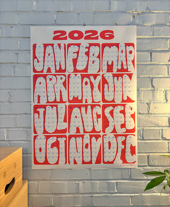 Keeps Home 2026 Goals with Studio Tigress Planner in Red and White on brick wall