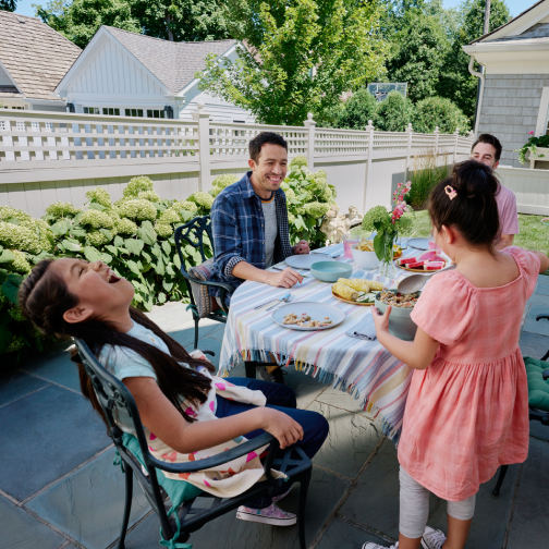 Family eating dinner outside