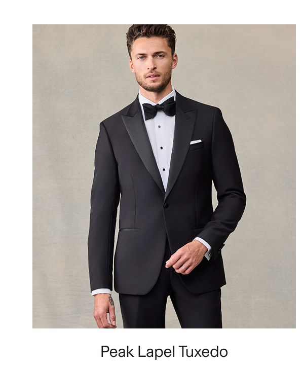 Male model wearing a black Peak Lapel Tuxedo with a white dress shirt, black bow tie, and white pocket square. Text reads: "Peak Lapel Tuxedo"