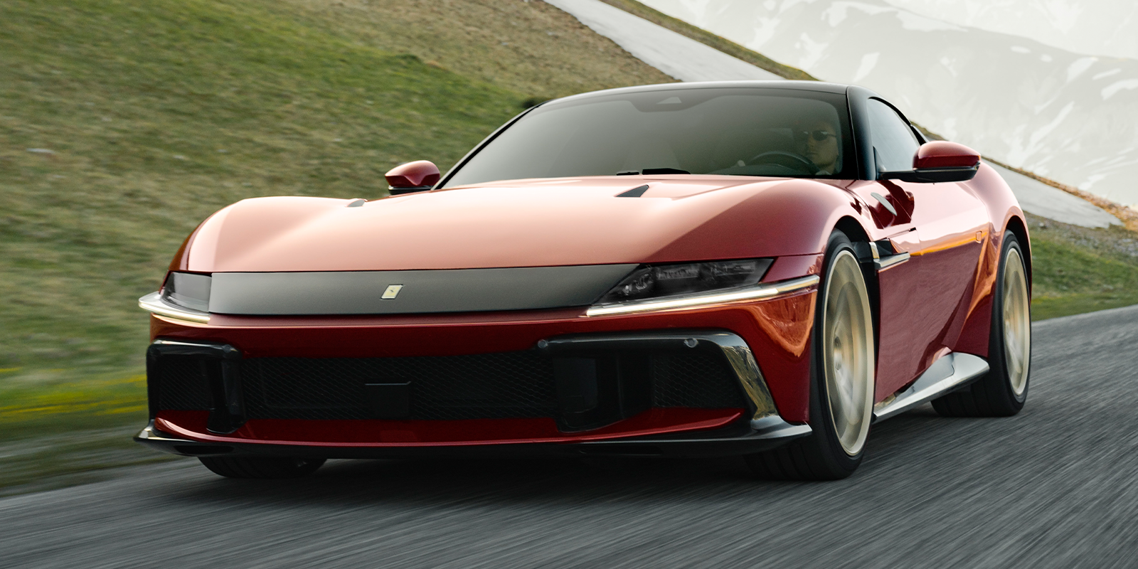 The brand-new Ferrari Dodici Cilindri in a deep red colour, linking to a article on Top Gear's website.