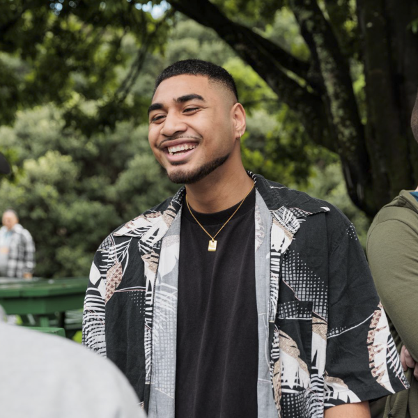 Student smiling and walking in the park