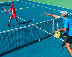 Coach and player on court