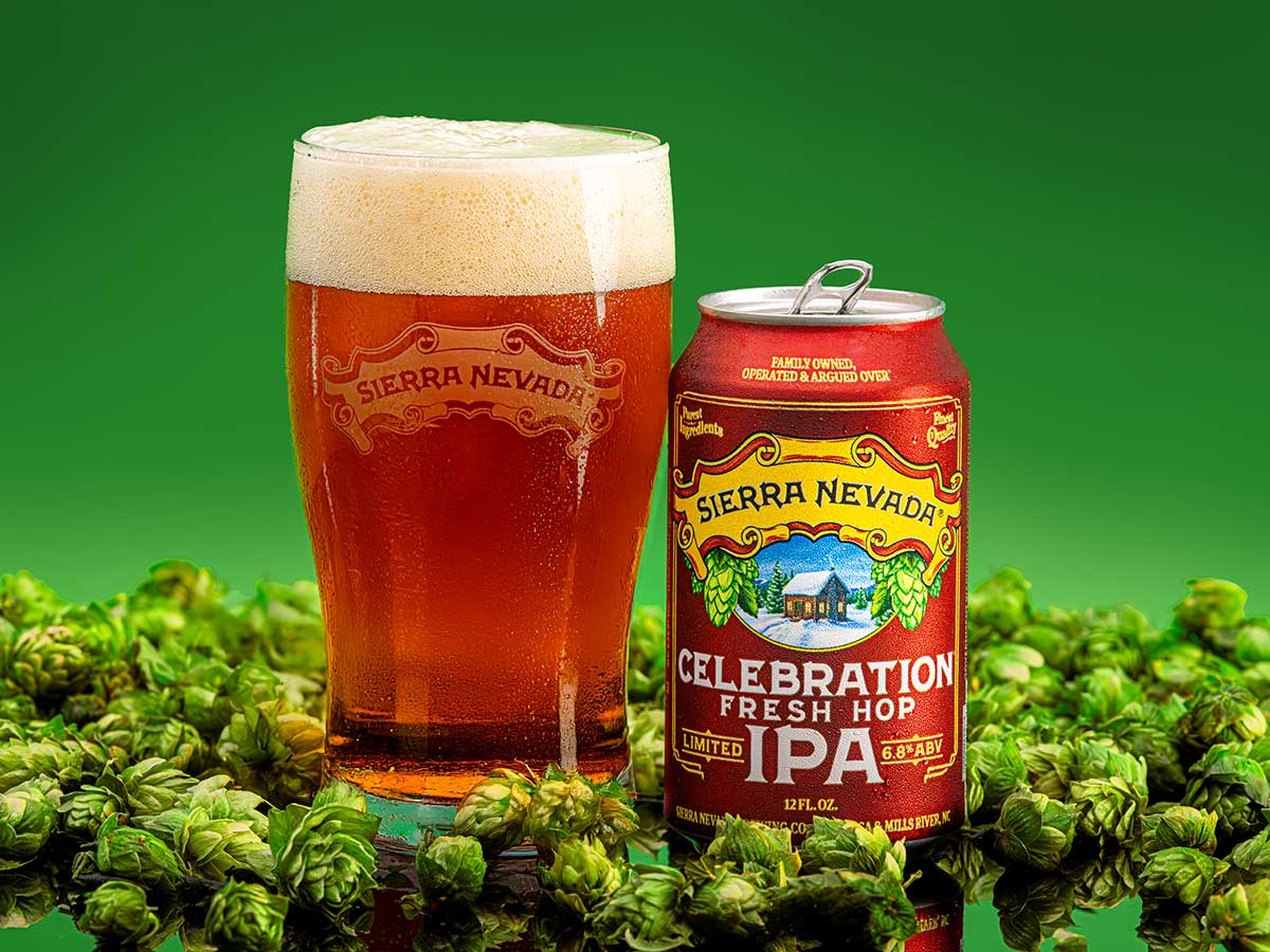 A pint glass and can of Sierra Nevada Celebration IPA