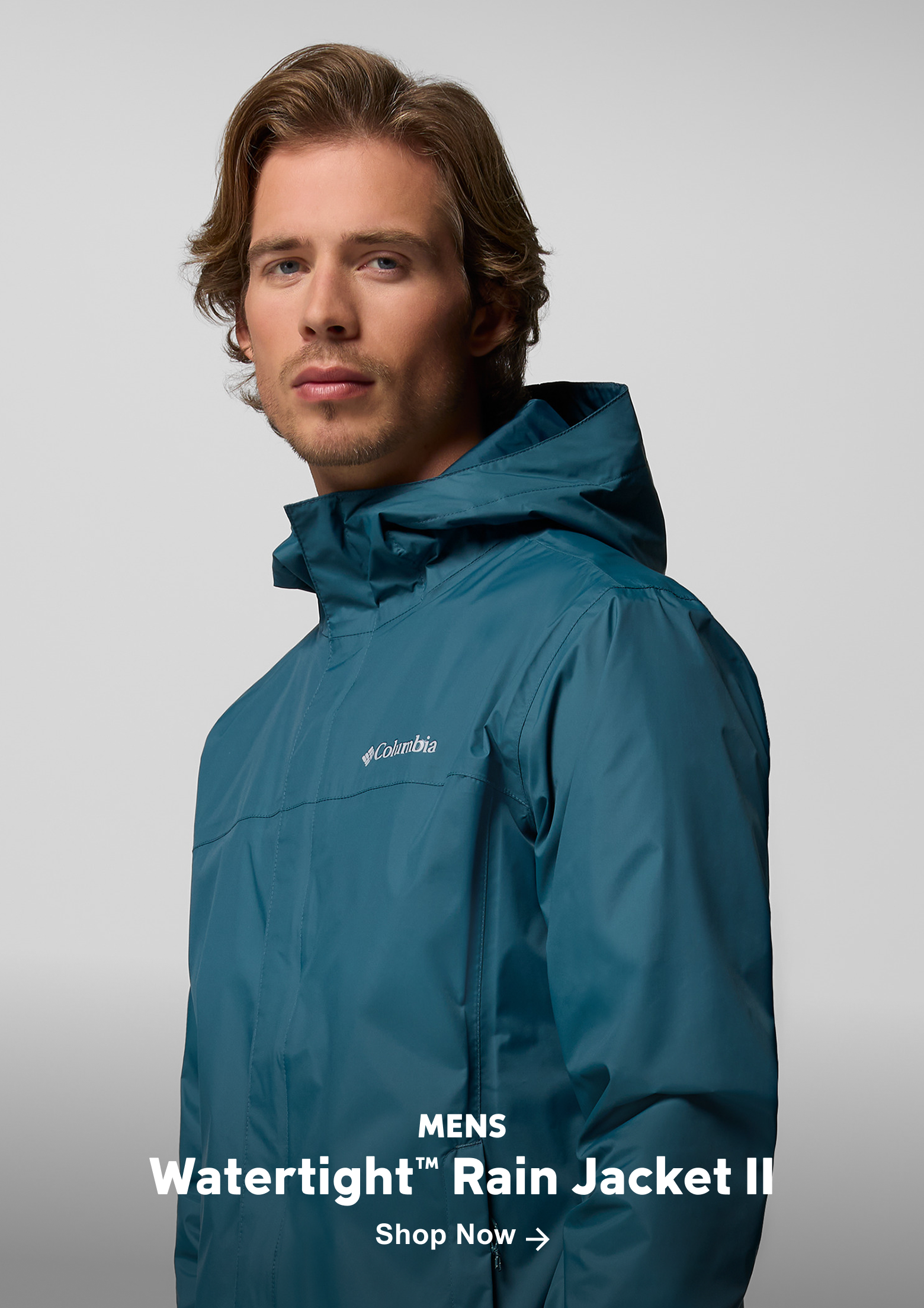 A man wearing the Watertight Rain Jacket