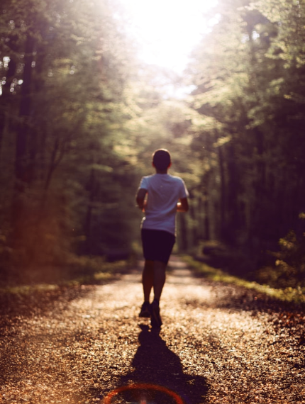 Student jogging on a trail