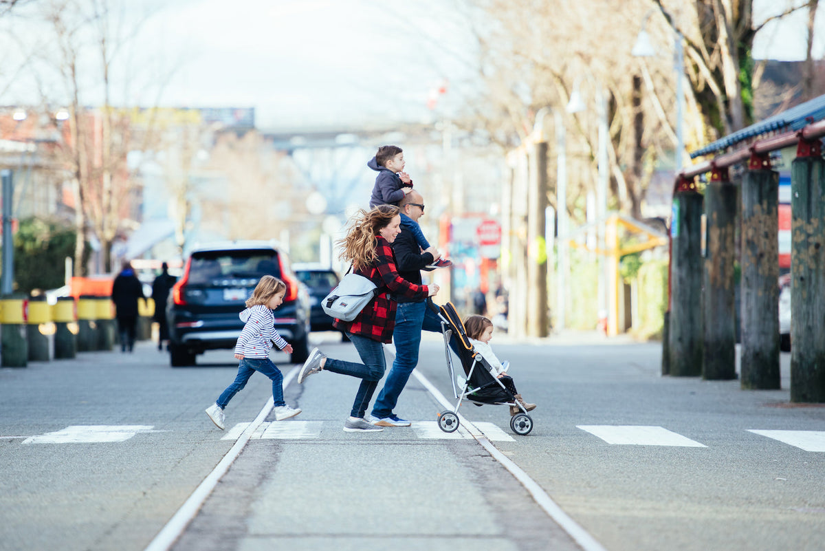 Family running across street with Medium Cafe Bag.