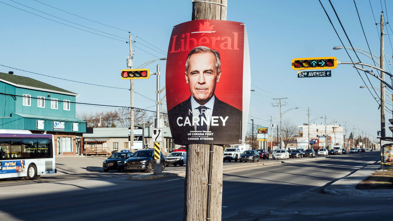 A poster for Canada's Liberal party candidate, Prime Minister Mark Carney, is attached to a telegraph pole. 