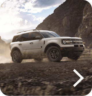 A Bronco&reg; Sport SUV Big Bend&reg; model being driven off‑road in a desert landscape