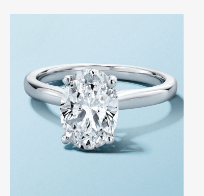 White gold oval-cut diamond solitaire engagement ring.
