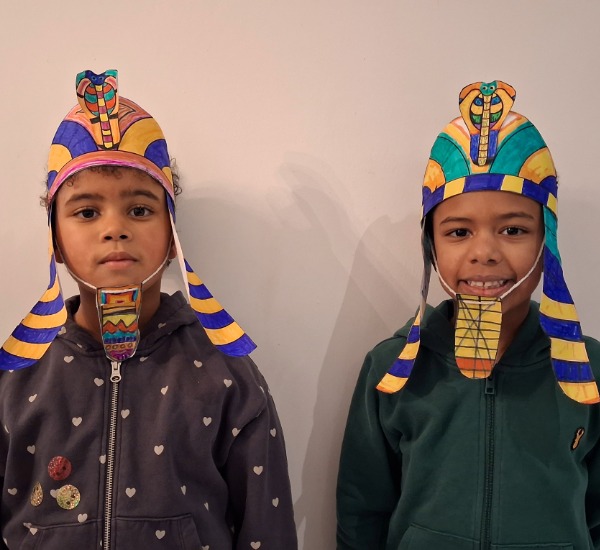 Two children in an Egyptian Nemes headdress. 