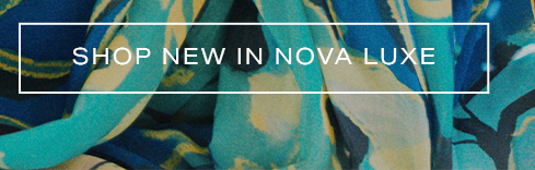 Abstract blue, teal, yellow, and black luxury fabric, draped and flowing. Shop new arrivals from the Nova Luxe fashion collection.