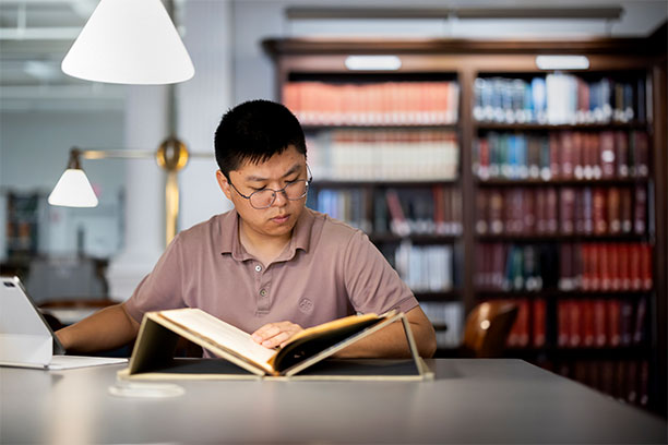Second-year David Sun examines primary source documents at the Historical Society of Pennsylvania for his Revolutionary Stories project.