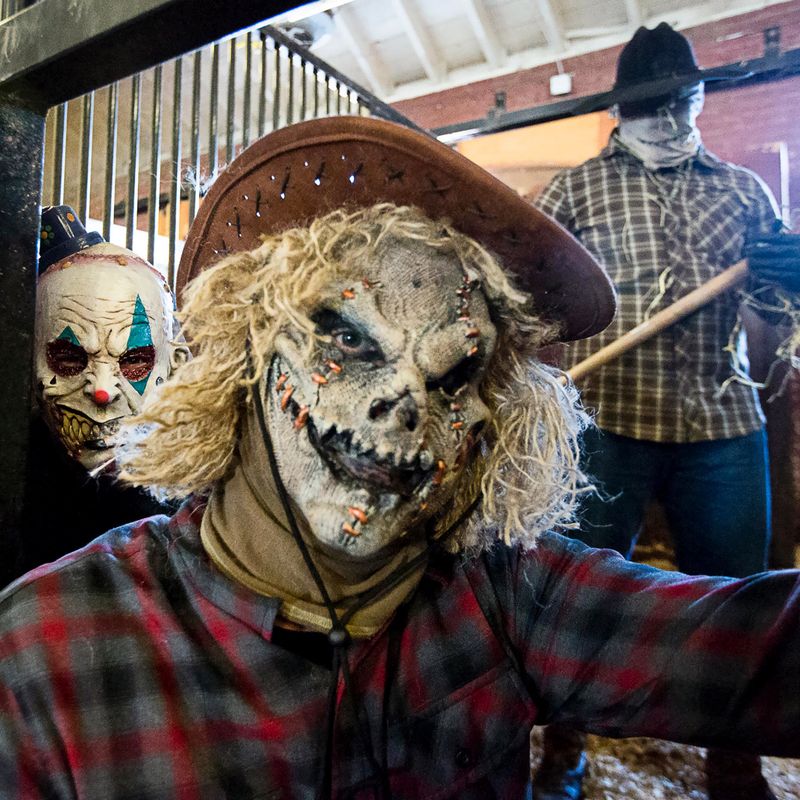 Three people in Halloween masks. 