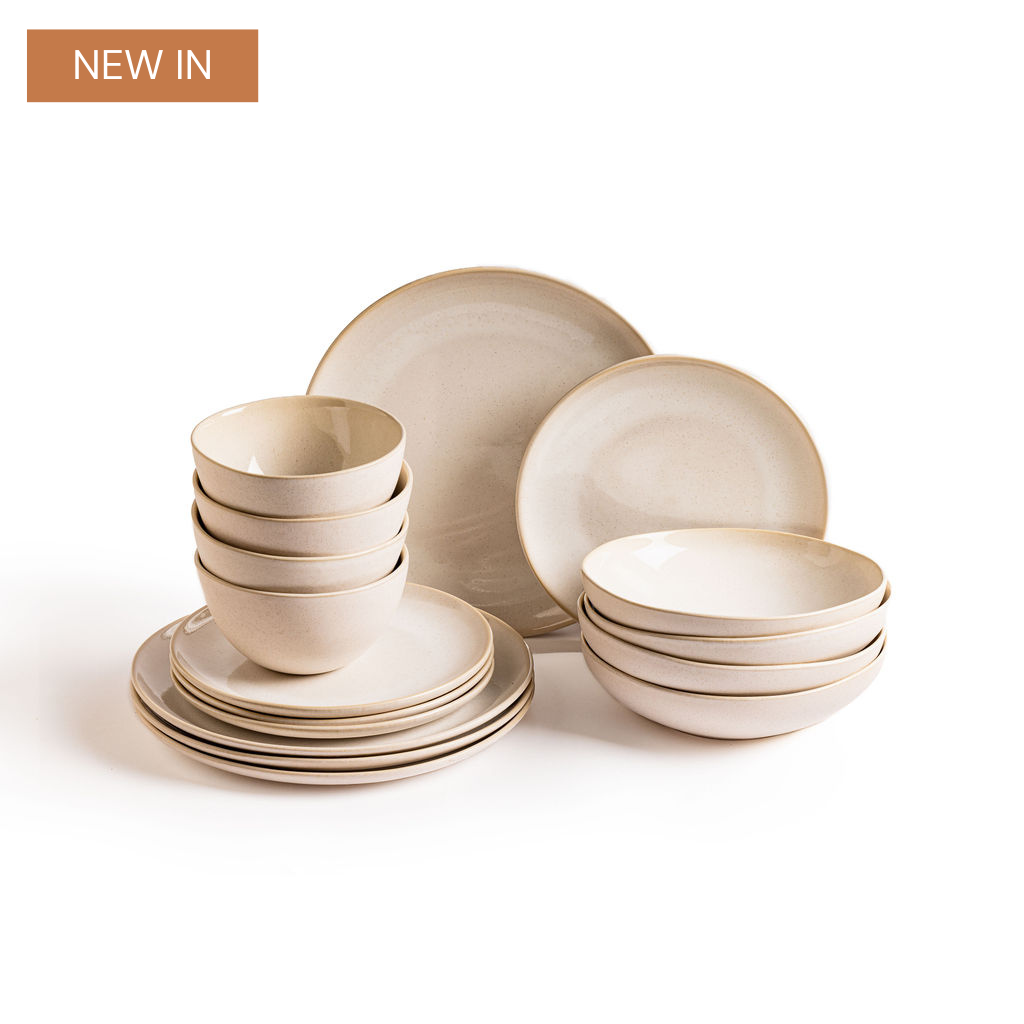 an image of a group of white dishes and cups on a white surface