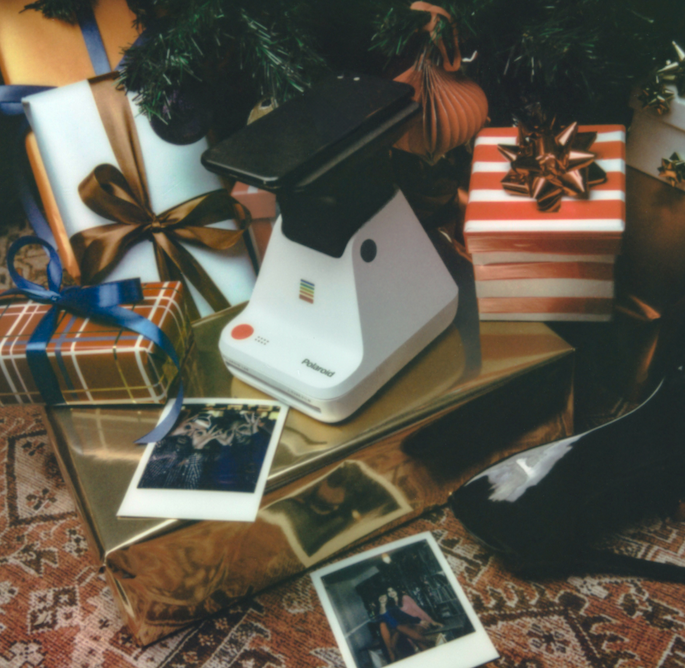 Polaroid Lab printer surrounded by holiday decorations