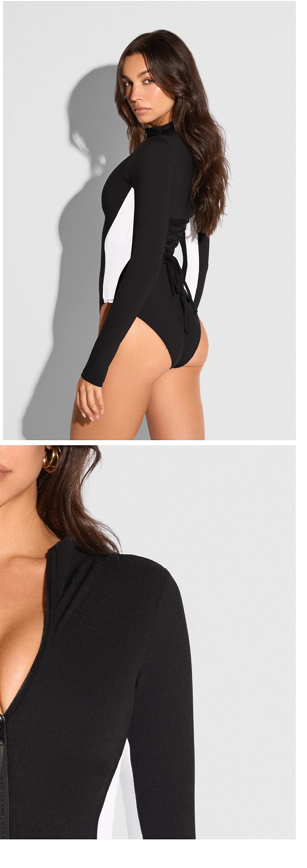Black and white long-sleeve swimsuit with a zip front and a tied back design.