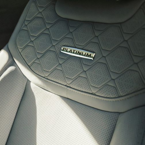 Interior detail shot of a front seat in a Star White Ford Explorer® Platinum® model