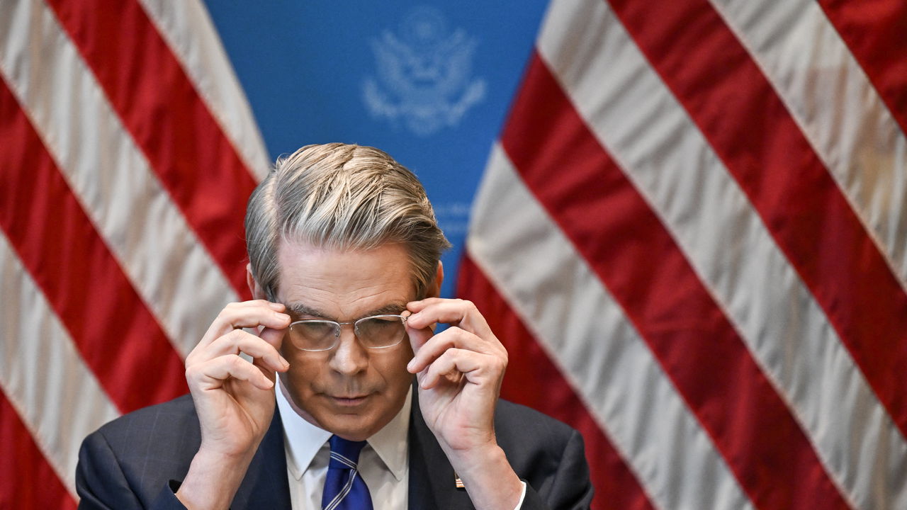 Scott Bessent gestures during a news conference in Geneva