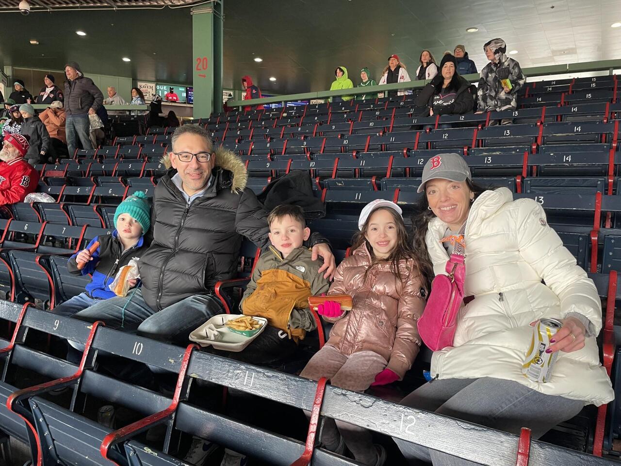 Leah Christoforidis (right) with her family at Fenway park.
