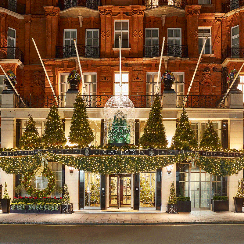 Rotating imagery of Christmas at Claridge's including festive decorations and a little girl unwrapping Christmas presents in front of a Christmas tree