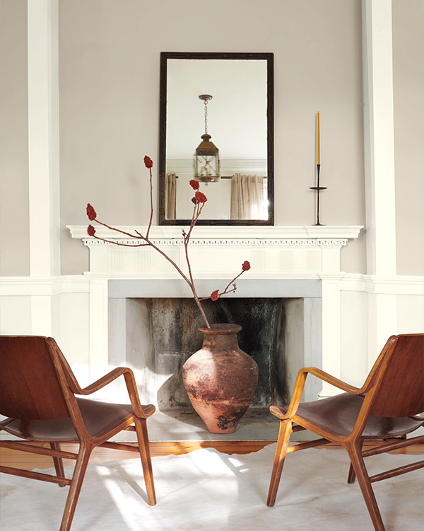 A living room with neutral walls and white trim.
