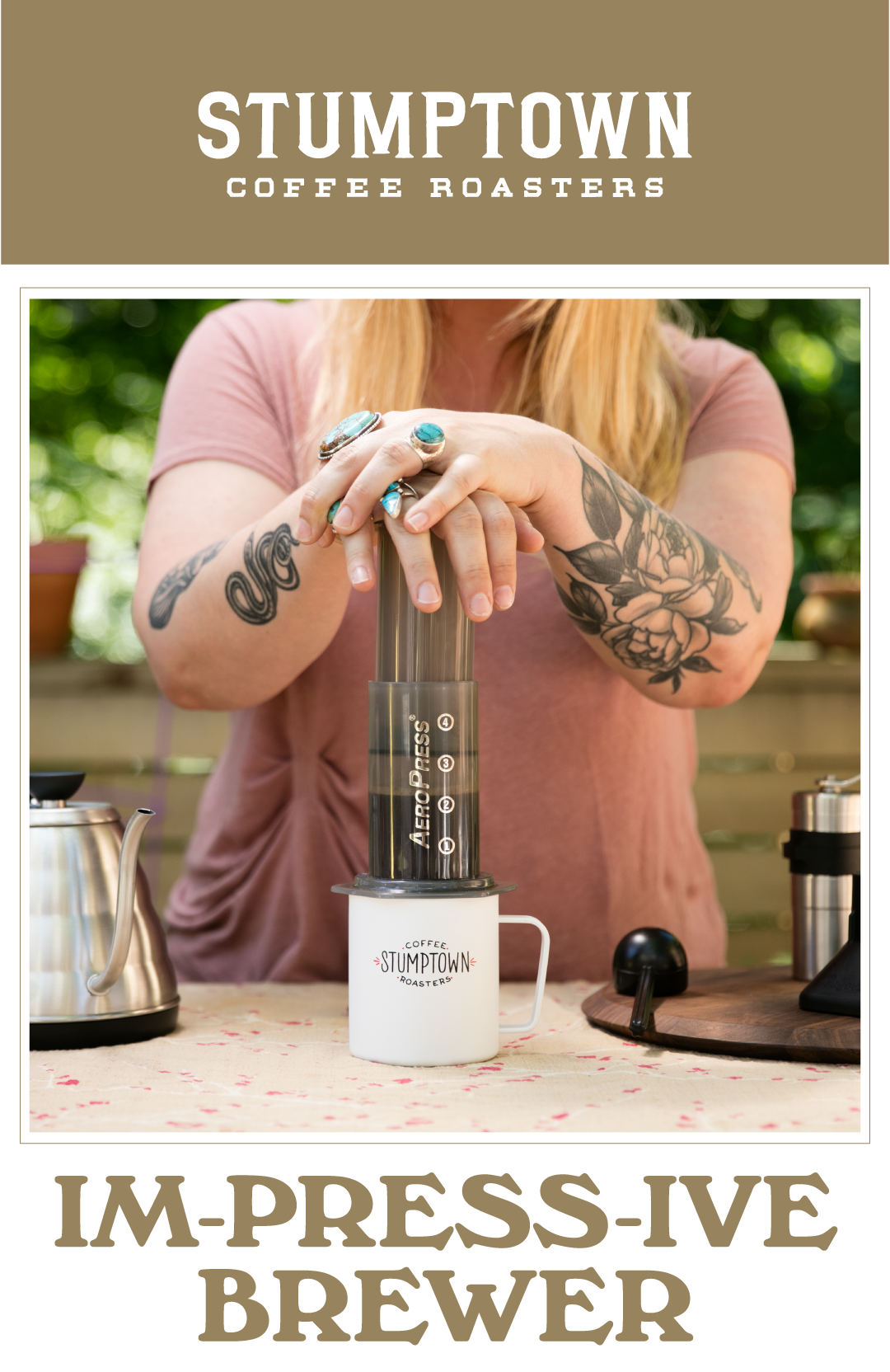Person pressing an AeroPress into a Stumptown mug. Text reads “IM-PRESS-IVE BREWER.”