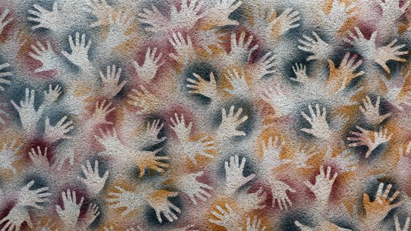 Negative hand imprint cave paintings on a wall