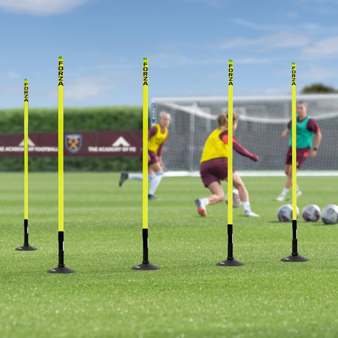 FORZA Astro Slalom Poles with bases, set up on a soccer pitch.