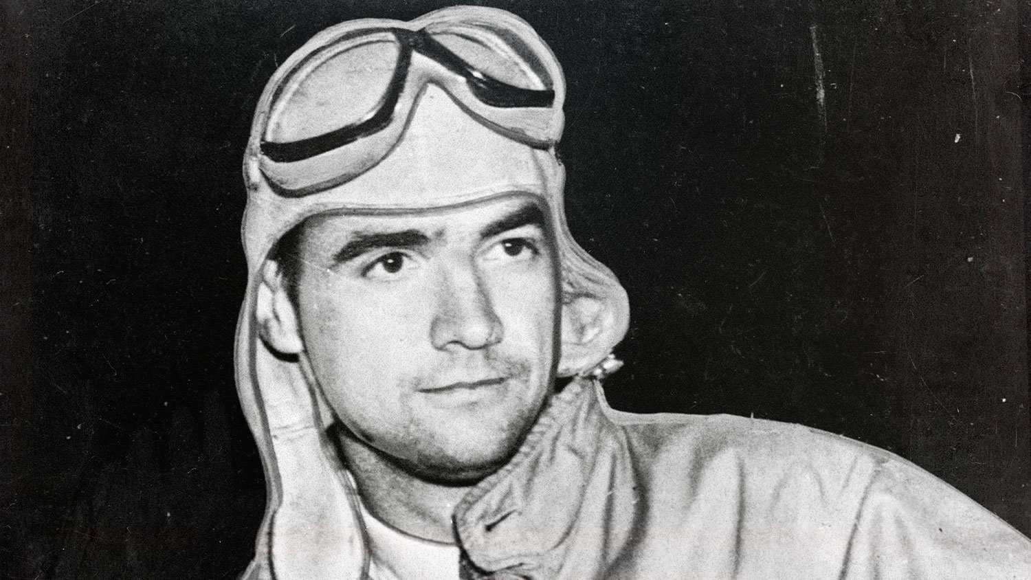 Howard Hughes wears pilot uniform. 