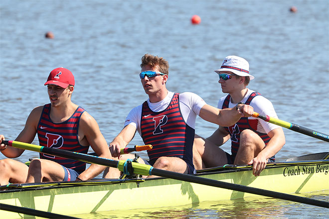 Cole Riedinger rows on the water with his teammates.