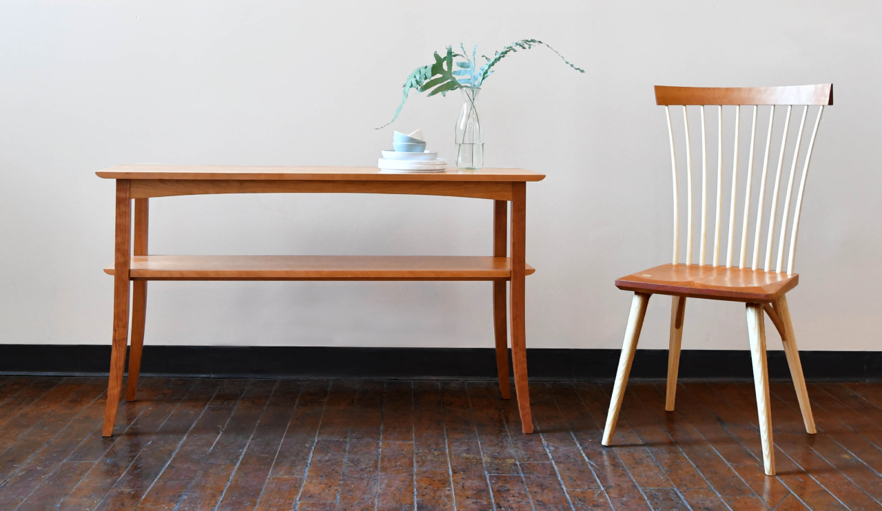 The wing hall table and eastward side chair in cherry.