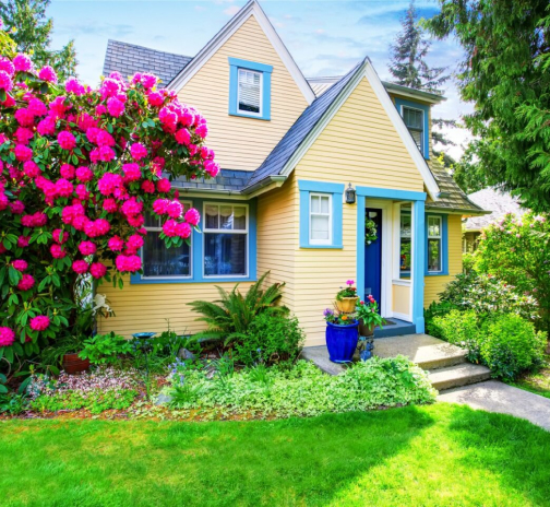 Home painted yellow with blue trim