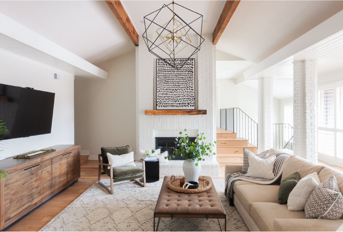 Transitional living room featuring modern art over fireplace and Ace Accent Chair.